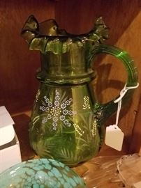 antique ruffle edged pitcher with enamel decoration