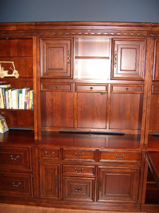 Middle section of cherry Hooker bookshelf/cabinet.