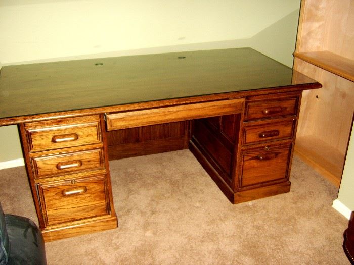 Executive desk with glass top.