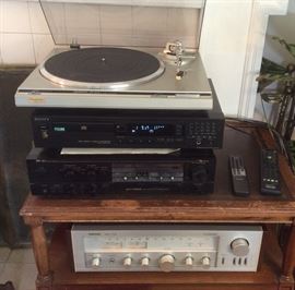 Stereo equipment: Technics SL-Q200 direct drive turntable, Sony CDP-491 CD player, Nakamichi SR-4A stereo receiver, Nikko NR-719 receiver. Not shown: pair of Advent Loudspeakers (each is 26" tall)