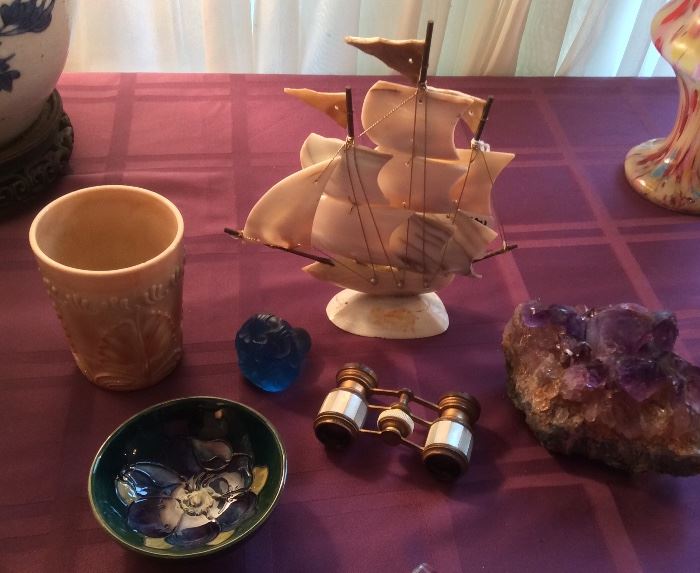 Caramel glass tumbler, Moorcroft Clematis bowl (with orig. paper label), blue glass stopper, French opera glasses, mother-of-pearl sailing ship, amethyst crystal 