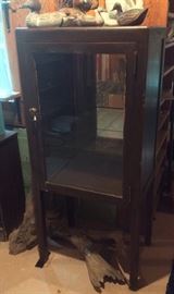 Wooden display cabinet on legs