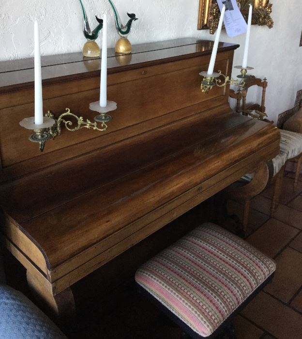 Piano with built-in candelabras for reading sheet music