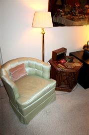 Upholstered armchair, end table, floor lamp