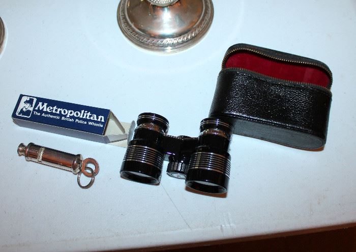 Vintage binoculars and police whistle