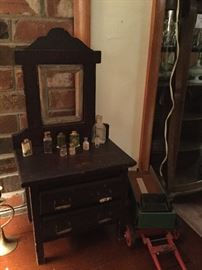 Miniature doll dresser and small bottle collection