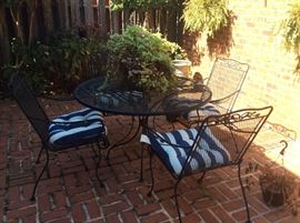 Wrought Iron Table and four chairs - complete with cushions