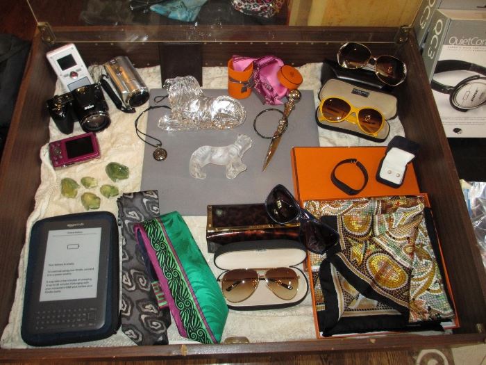 Hermes scarf, lalique tiger, waterford lion, digital cameras, channel sunglasses, jade frogs