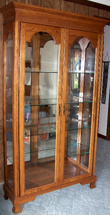                             Lighted oak display cabinet