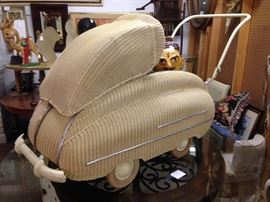 (Is this a baby carriage that looks like a car, or a car that looks like a baby carriage?) Well, its actually a WICKER SCHLEGEL GERMAN KINDERWAGEN. 