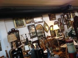 Every wall covered with mirrors and framed pieces.