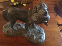 statue hunting dog with fish