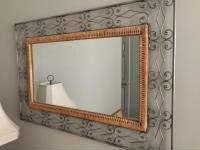 Metal and wicker framed mirror