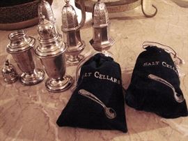 Sterling salt and pepper shakers and sterling salt spoons with individual salt cellars.