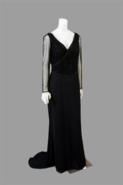 Black elegance with a chapel train. This dress will make a grand entrance. Loop on train. Subtle beadwork trim.