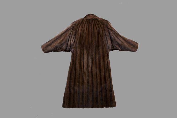Back view showing bat wing sleeves and gathers at neckline.