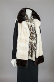 Gorgeous white mink vest with ranch mink collar and banding on hem. 