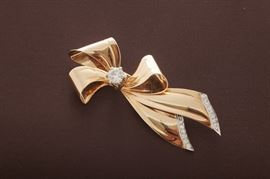 14k brooch with diamonds.