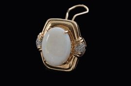 Front view of opal ear clips. The opal is more colorful than shows in the photo.