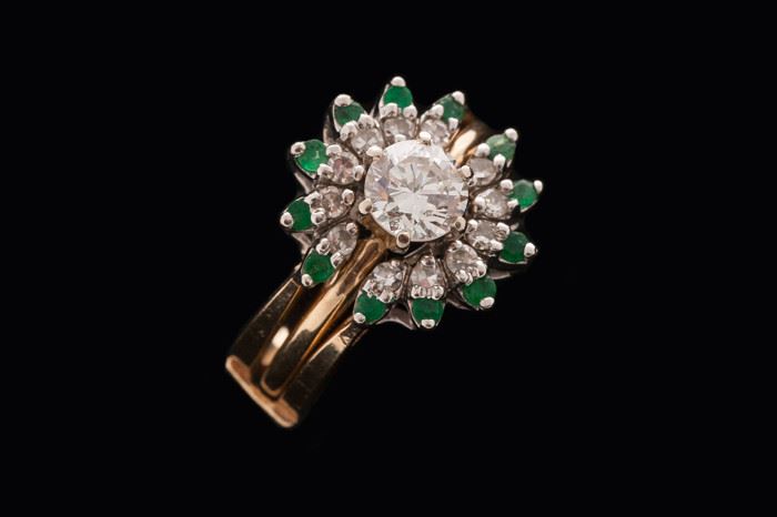 Solitaire with emerald and diamond guard.