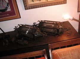 pair of wrought iron hanging light fixtures