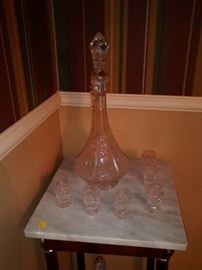 Decanter and cordial set on top of marble accent table (2)