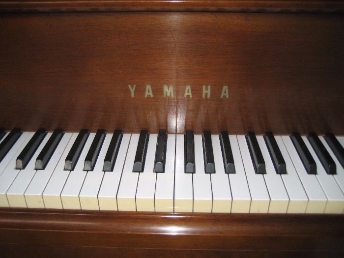 Closeup of Yamaha baby grand piano