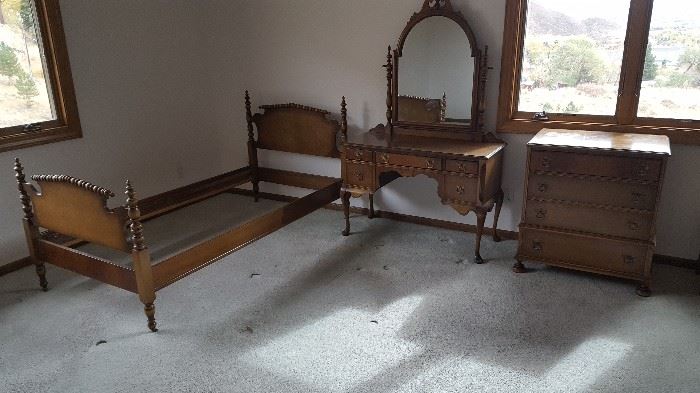 Circa 1920 bedroom set by Berkey & Gay Furniture -- single "Jenny Lind" style bed with matching vanity & mirror, four-drawer dresser and bed-side table. The top of the dresser needs to be refinished.All hardware original.