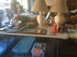 Lamps, set of wood sconces, Free standing zip up canvas closet set, tub of Christmas wrapping paper, boxes & colored tissue. More medical information packets.