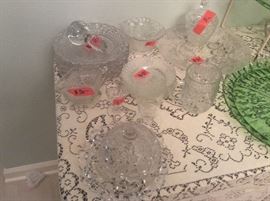 Glass small ladle, butter plate & lid, miscellaneous pressed glass embossed clear glass items.