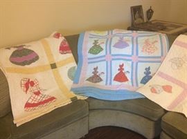 (2) different vintage quilts with ladies on them