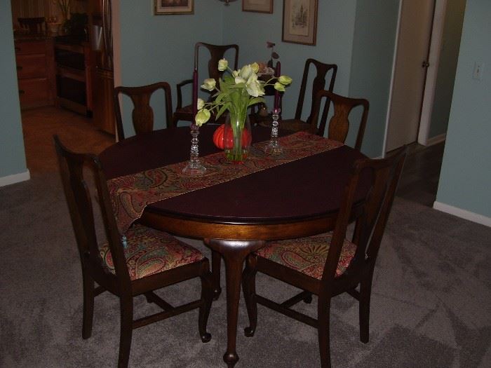 Antique table and 6 chairs.
