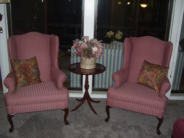 Wing back chairs and antique pedestal table.