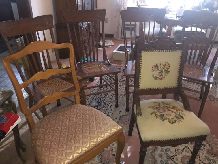room full of antique chairs