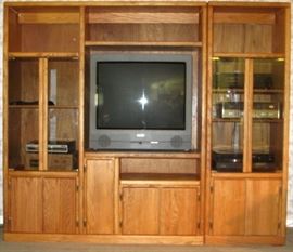 Thornwood Oak Media Entertainment Wall Unit shown with 32" Sanyo TV and various electronic components (83"W X 71"H)
