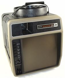 KODAK EKTAGRAPHIC AudioViewer Projector 270 Auto Focus. Records and play program pause and restart via control panel or remote control. 9 x 9 inch rear projection viewing screen with Built-in cassette tape player and loudspeaker