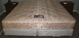 Simmons Kingsize Beauty Rest Mattress on a pair of twin mattress box springs and metal bed frame.
