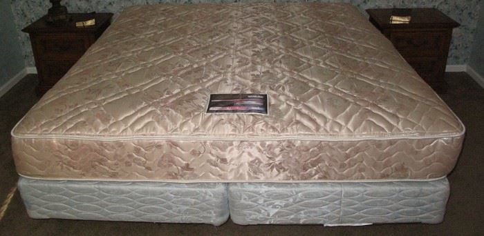 Simmons Kingsize Beauty Rest Mattress on a pair of twin mattress box springs and metal bed frame.   