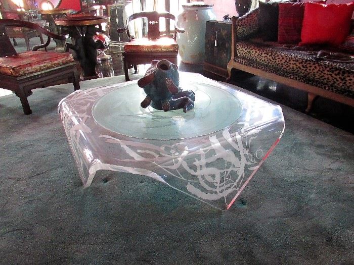 Bespoke acrylic and etched glass handkerchief coffee table with ceramic koi sculpture.