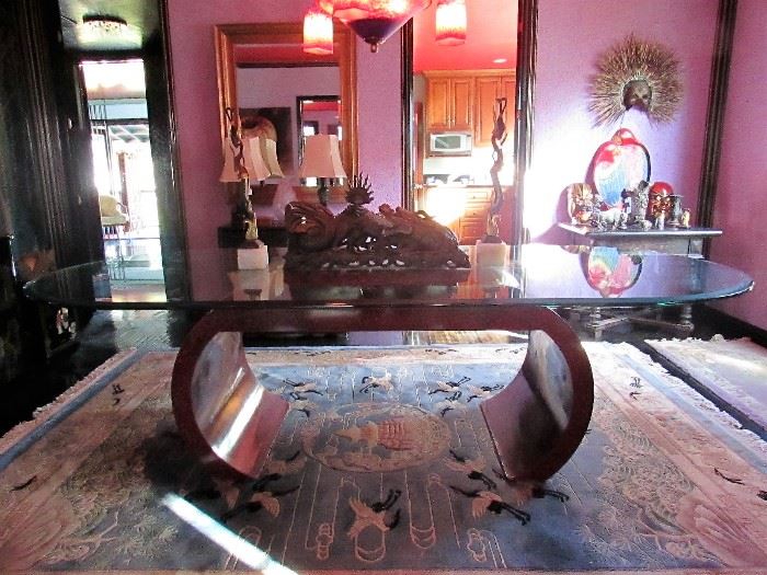 Contemporary burled wood and beveled glass dining table seats up to 12. Amazing Chinese carved wood dragon centerpiece.