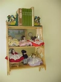 Collection of Madame Alexander dolls and painted shelf