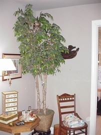 Huge faux tree; Florentine boxes, vanity items, wall lamps, and Victorian chair