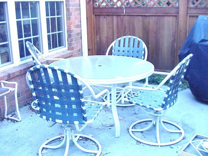 Patio table with four chairs, and umbressa (not shown)