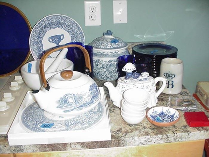 Lots of blue and white items as well as a set of cobalt dishes and bowls, ceramic teapot