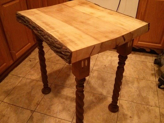 one of a kind table with hand whittled legs 