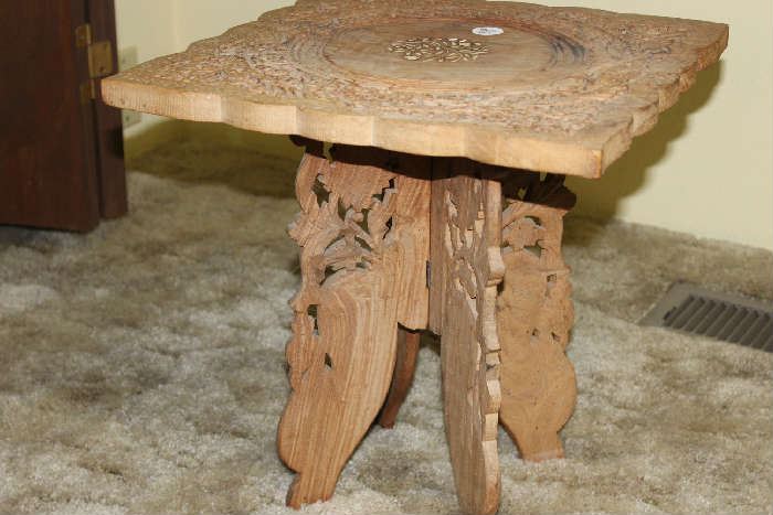 Decoratively carved end table
