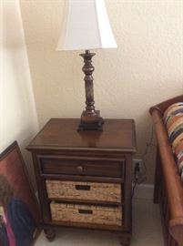 Pair of matching end tables with one drawer and 2 shelves with baskets. Also, a pair of matching lamps