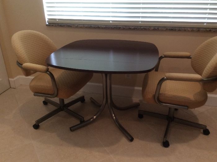 Kitchen table 36x36 with ends that drop down and two arm chairs