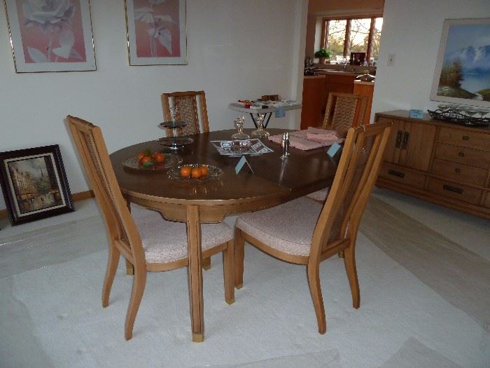 Vintage Dining Table with 4 upholstered and cane back chairs, 2 table leaves, custom table pads