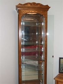 SOLID OAK LARGE CURIO CASE!! GLASS SHELVES. LIGHTED WITHIN TOO. NEW CONDITION! WILL HOLD ALL YOUR TREASURES!